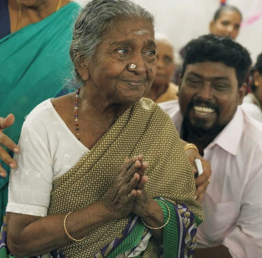 Rescued elders sharing a meal at a KUT care centre.