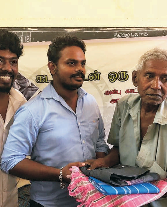 Folded blankets and bedsheets donated for rescued homeless people in Tamil Nadu